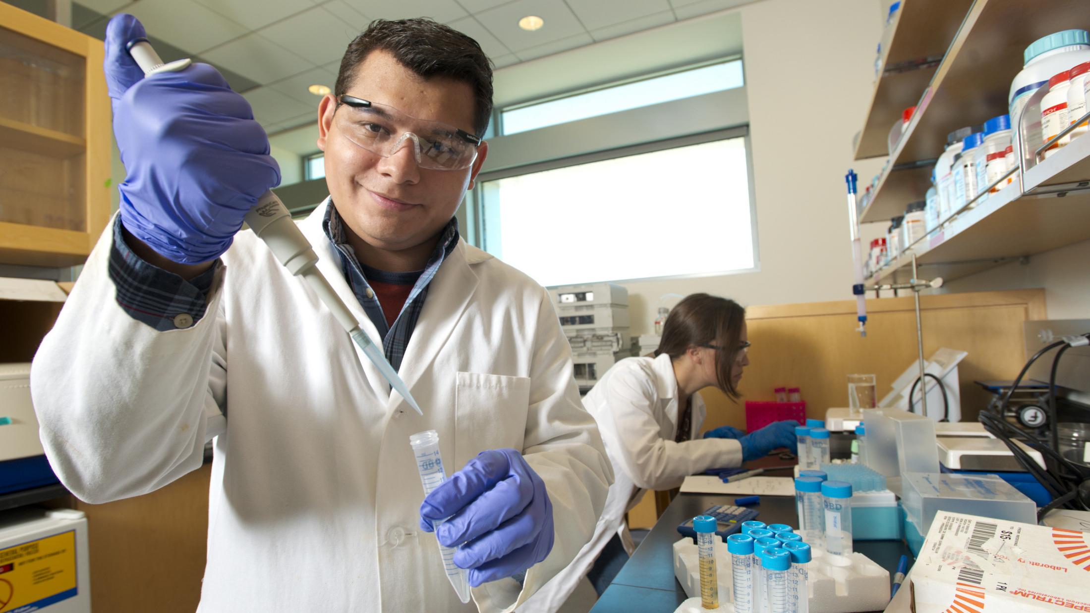 Graduate students working in a lab